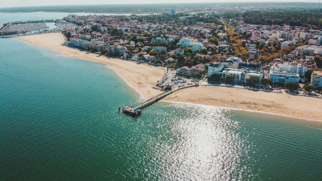 Stunning aerial view of Arcachon in Nouvelle-Aquitaine, France, highlighting the coastline and cityscape.